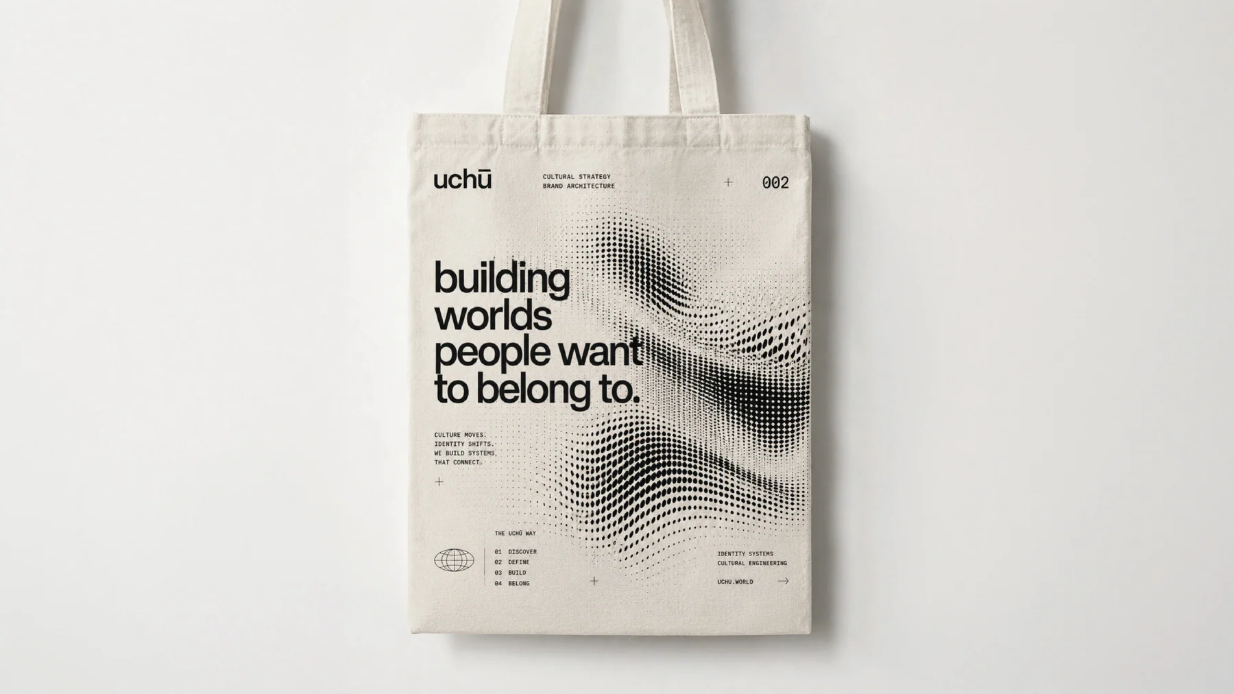 Linnen draagtas met de regel building worlds people want to belong to en de halftonestreek